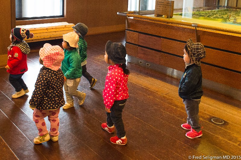 20150312_104507 D4S.jpg - Children visiting museum area at Nagoya Castle.  Well-mannered and quite interested in what they see.